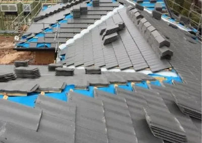 New tiled roof installation with battens and roofing materials in place