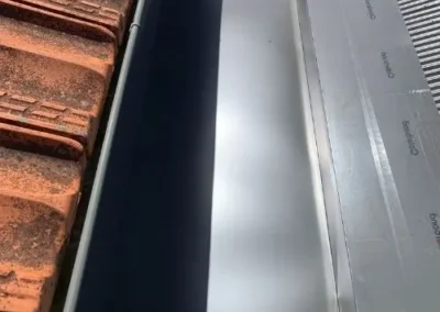 Close-up of new ridge capping and roof flashing