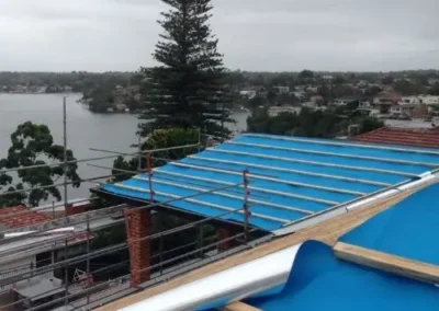 Blue roof sarking and battens installed during roofing work