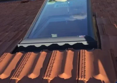 Roof skylight installed within a tiled roof