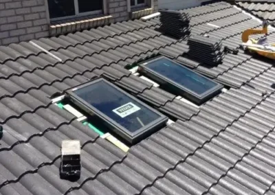 Roof skylights and surrounding tiles on a residential roof