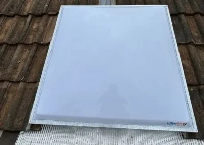 Rectangular skylight installed on a residential tiled roof