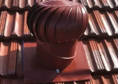 Roof ventilator installed on a terracotta tiled roof
